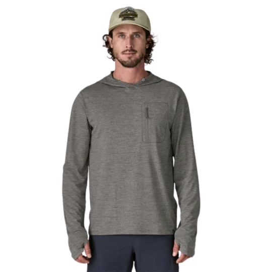 Man wearing a gray hoodie and cap on a white background