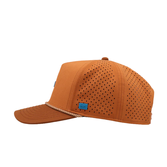 Orange cap with perforated design on a white background