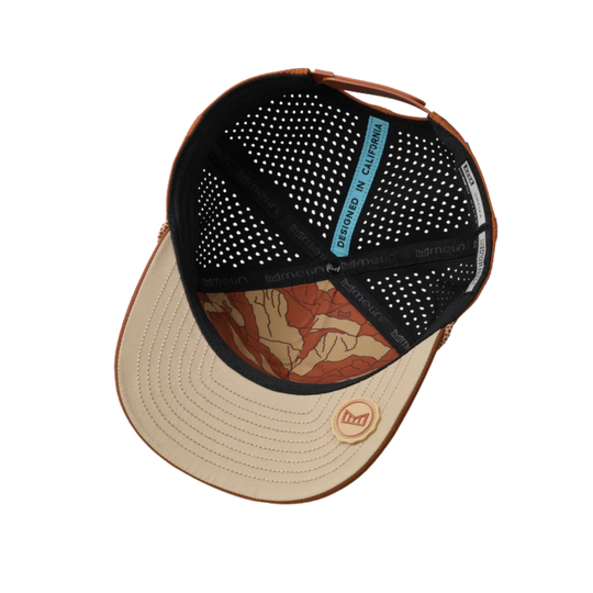 Multicolored cap with a patterned brim on a white background