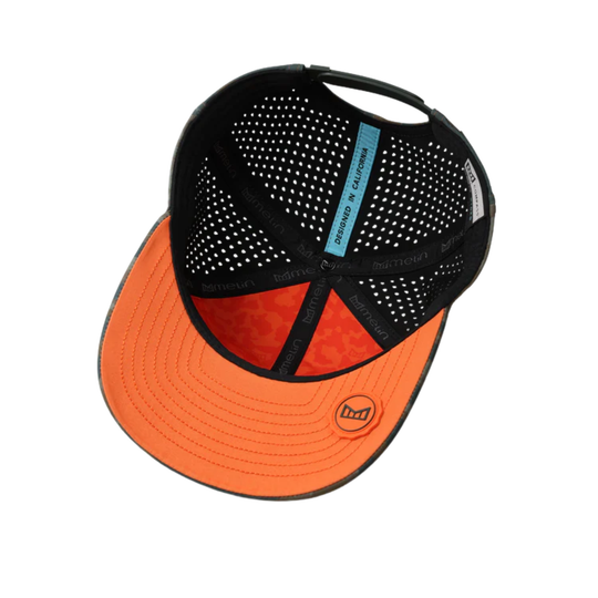 Black and orange cap with mesh back on a white background