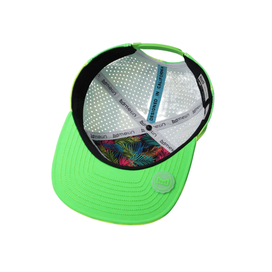 Neon green cap with a colorful palm leaf pattern on the brim against a white background