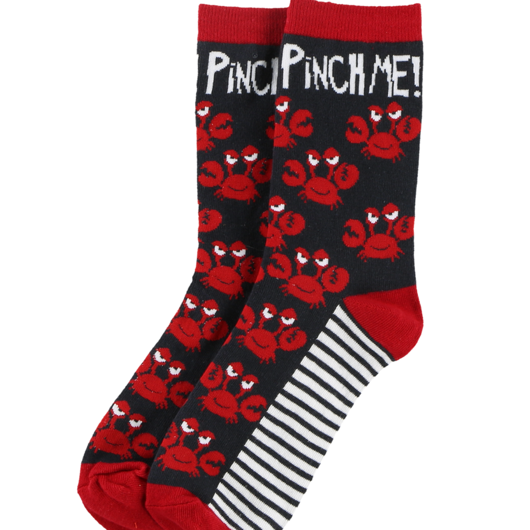 Socks with red crab pattern and 'Pinch Me!' text on a black background