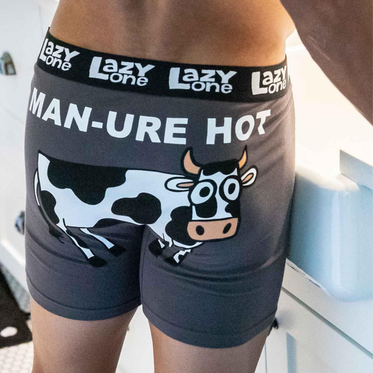 Boxer briefs with cow design and 'Lazy One' branding.