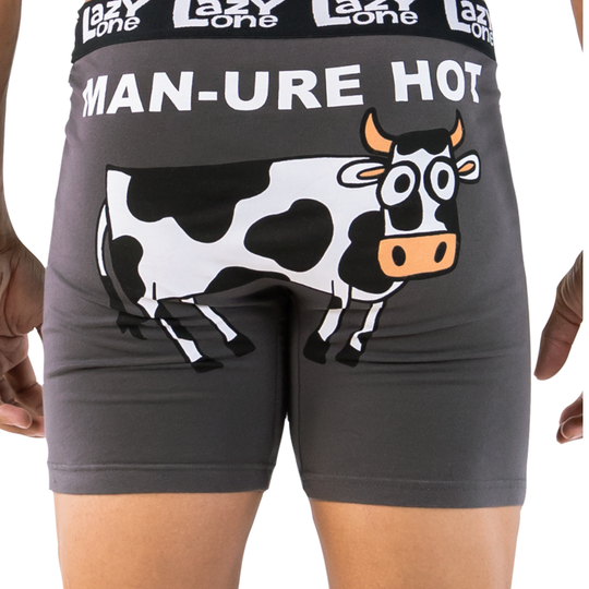 Gray boxer briefs with a cow design and text on a white background