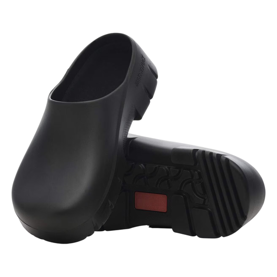 Black rubber clogs on a white background