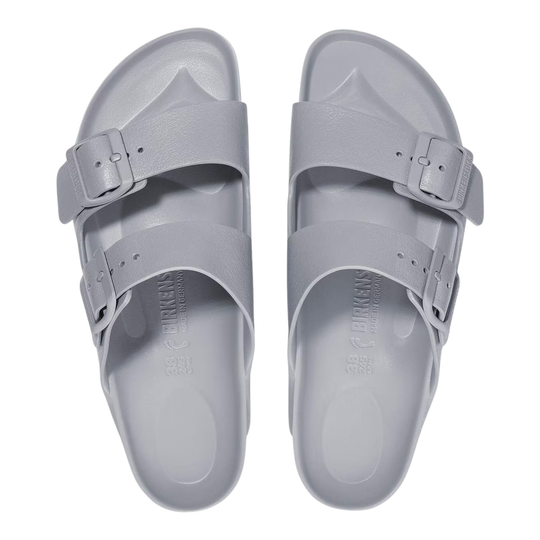 Pair of gray sandals with buckle straps on a white background