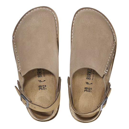 Pair of beige sandals with 'Birkenstock' branding on a white background