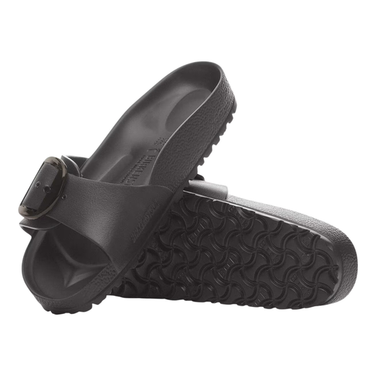 Black sandals with a buckle on a white background