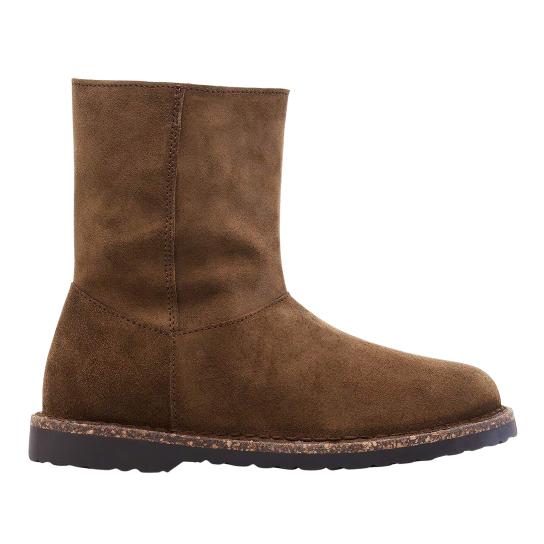 Brown suede boot on a white background
