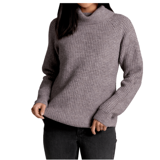 Person wearing a textured gray sweater on a white background