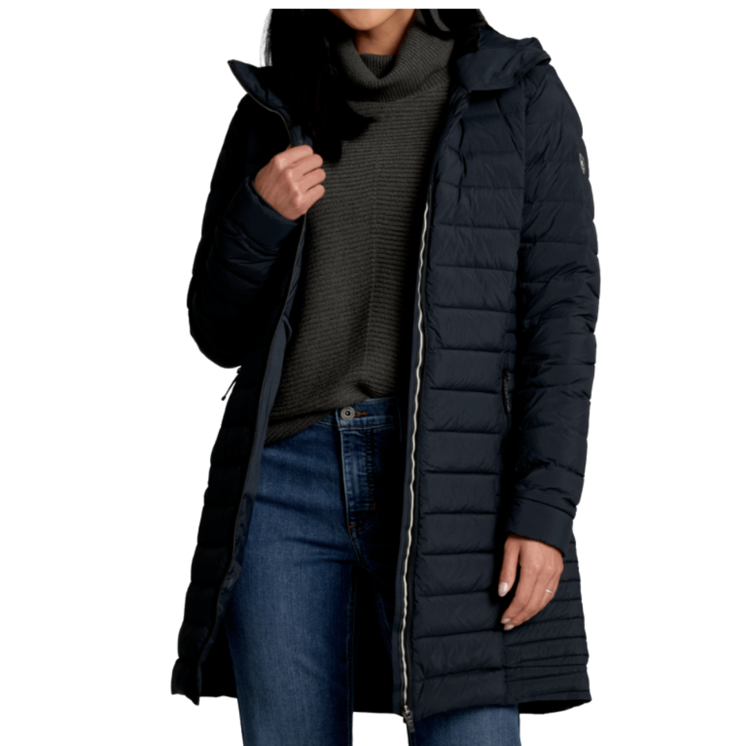 Person wearing a long black puffer coat on a white background