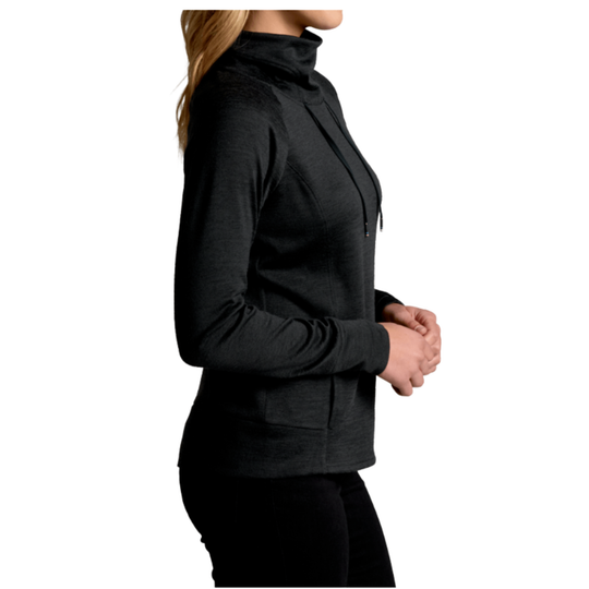 Person wearing a black long-sleeve top on a white background