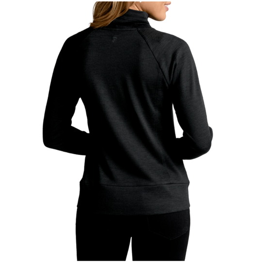 Black long-sleeve top worn by a person on a white background