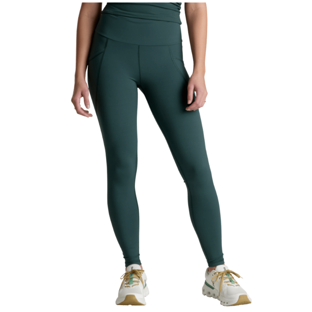 Person wearing teal leggings on a white background