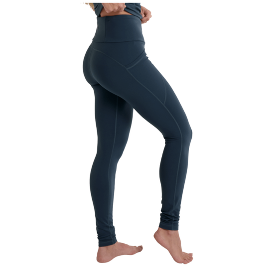 Navy blue leggings worn by a person on a white background