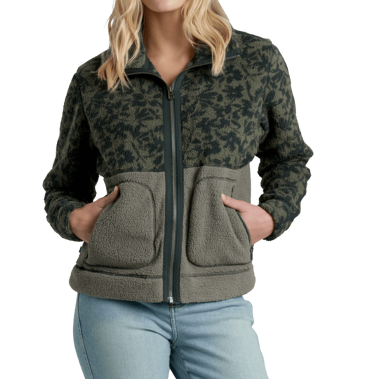Woman wearing a camouflage patterned jacket with a white background