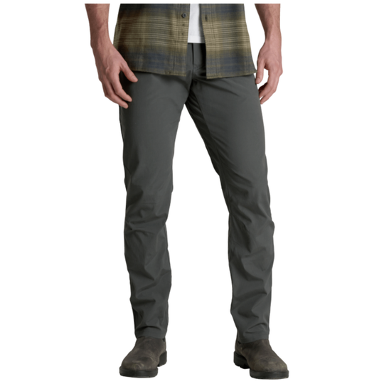 Person wearing gray pants on a white background
