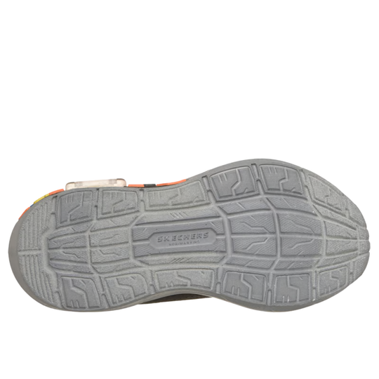 Close-up of a shoe sole with 'Skechers' branding on a white background