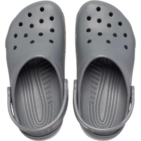 Pair of gray clogs on a white background