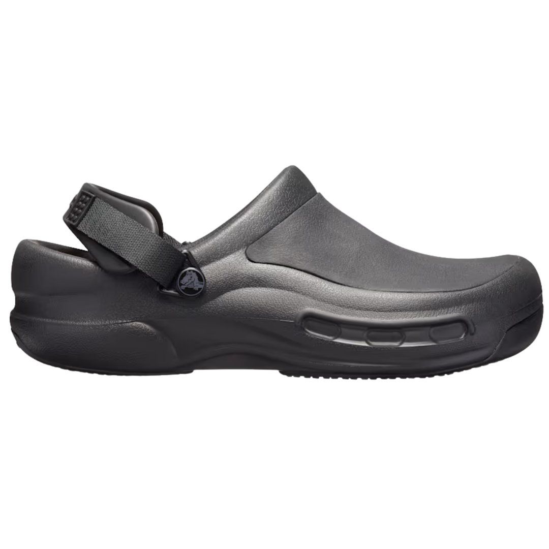Black clog shoe with a strap on a white background