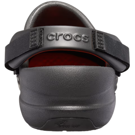 Gray clog shoe with black strap and orange interior on a white background