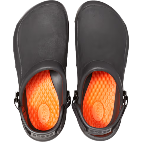Black rubber crocs with orange soles on a white background