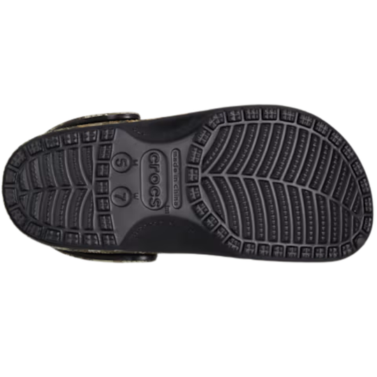 Black Crocs shoe sole on a white background