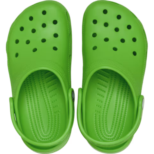 Pair of green clogs on a white background