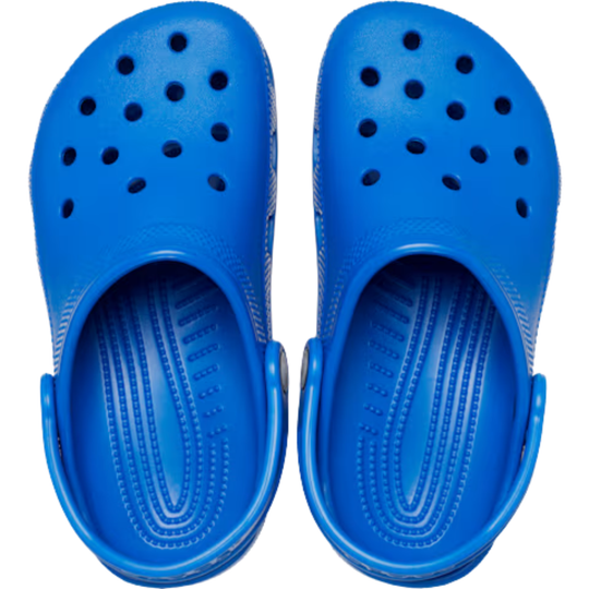 Pair of blue clogs on a white background