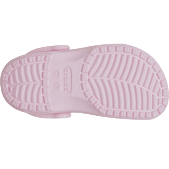 Close-up of a pink sandal sole with brand logo on a white background