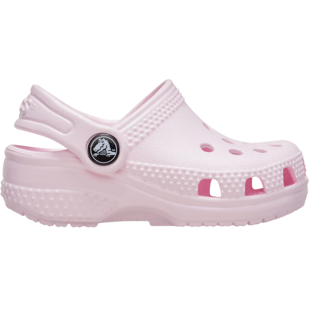 Pink clog shoe with a brand logo on a white background