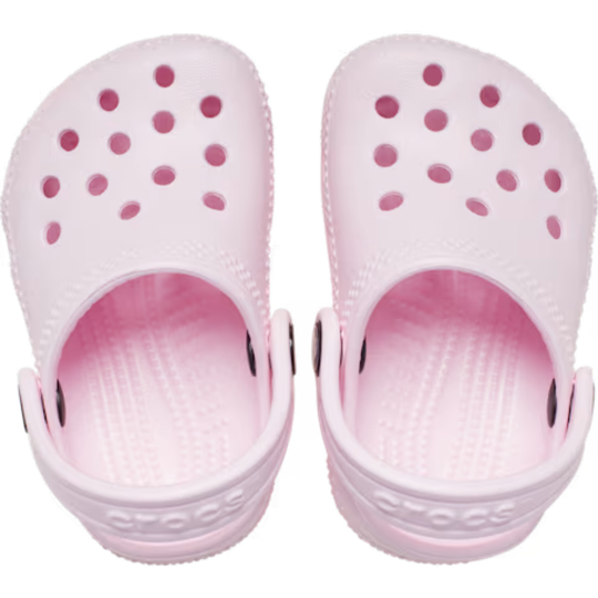 Pair of pink clogs on a white background