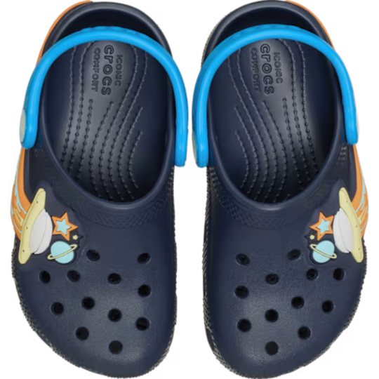 Blue Crocs with UFO, planets, and stars on a white background