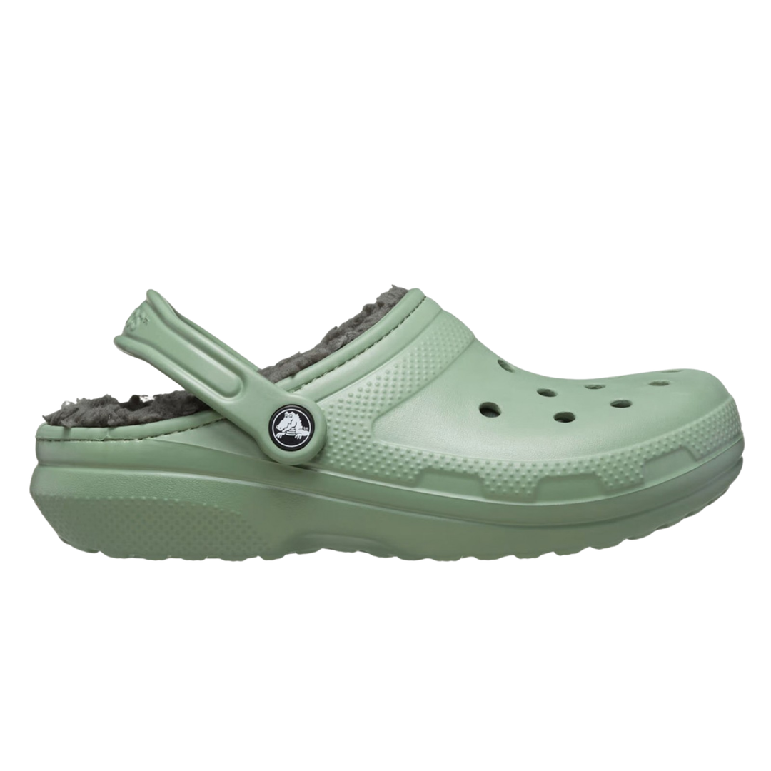 Green clog shoe with fuzzy lining on a white background