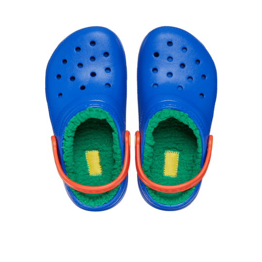 Blue children's clogs with green interior and orange straps on a white background