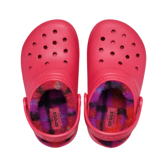 Pair of pink Crocs clogs with multicolored lining on a white background
