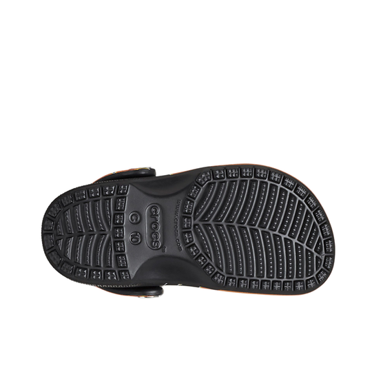 Black sandal sole with tread pattern on a white background