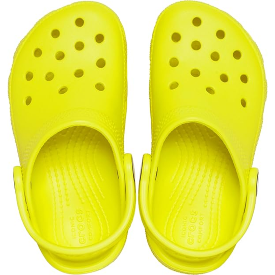 Pair of yellow clogs on a white background