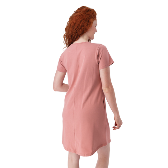 Woman wearing a pink dress on a white background