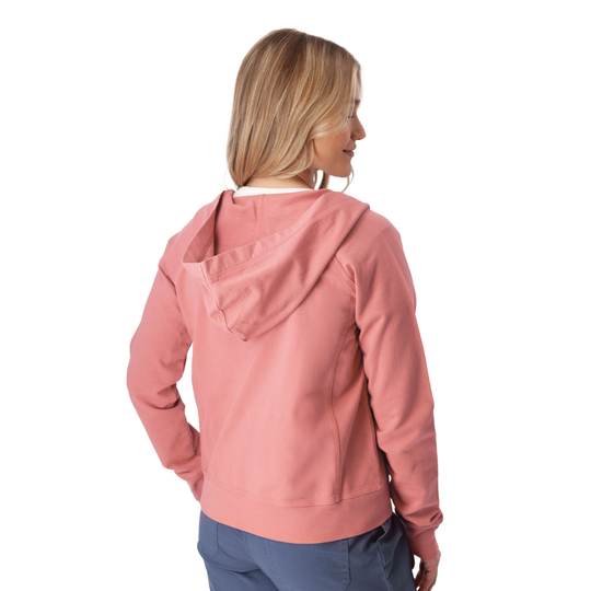 Woman wearing a pink hoodie on a white background