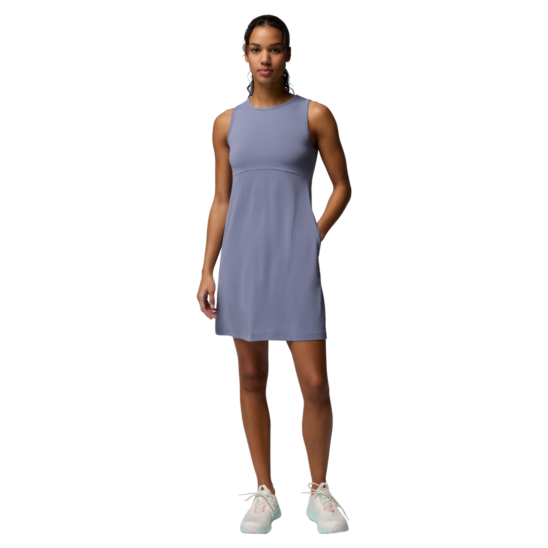 Woman wearing a light purple dress on a white background