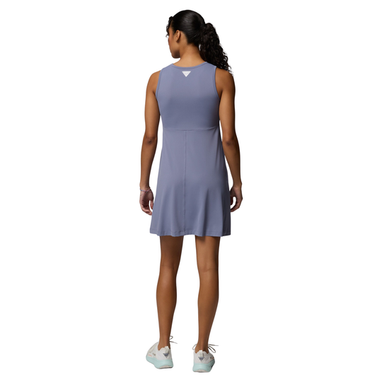 Woman wearing a sleeveless purple dress on a white background