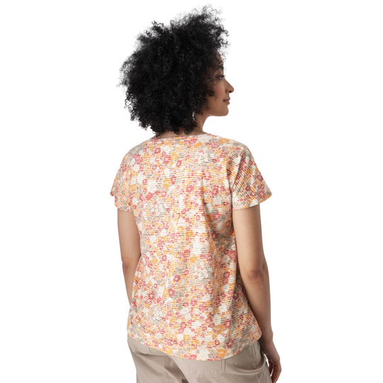 Woman wearing a colorful patterned shirt on a white background