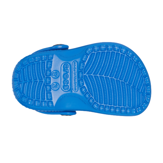 Blue sandal with textured sole on a white background