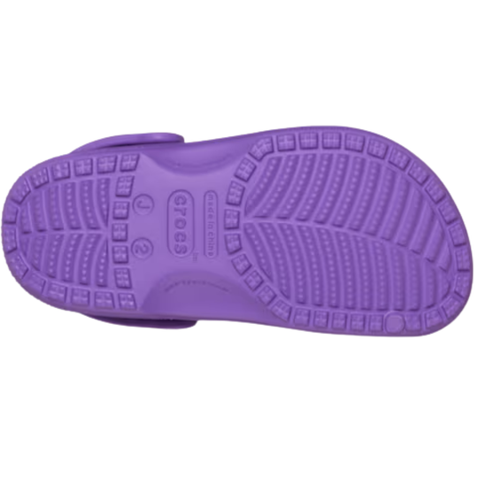 Purple sandal sole with textured pattern on a white background