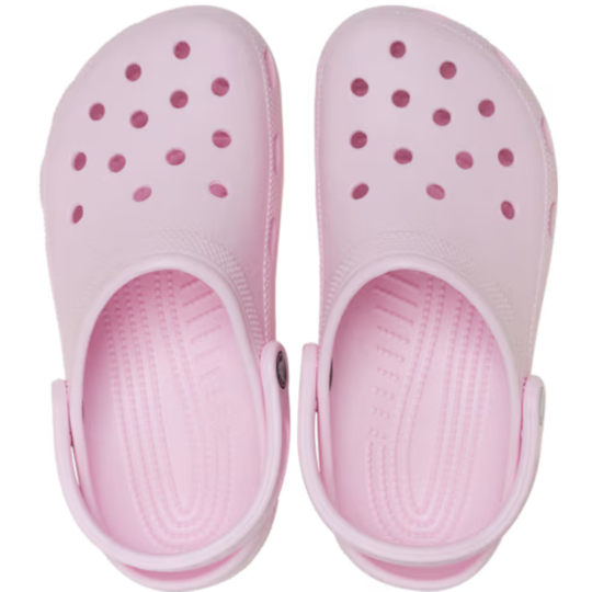 Pair of pink clogs with white straps on a white background
