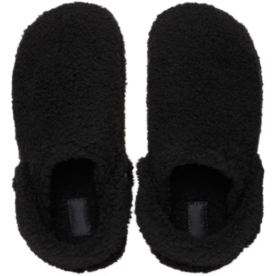 Pair of black fuzzy slippers on a white background