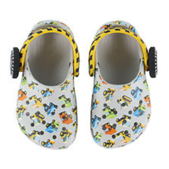 Pair of baby shoes with vehicle pattern on a white background