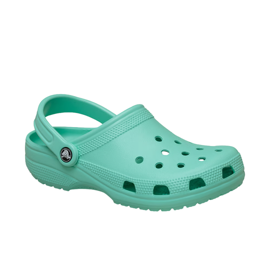 Turquoise clog shoe on a white background