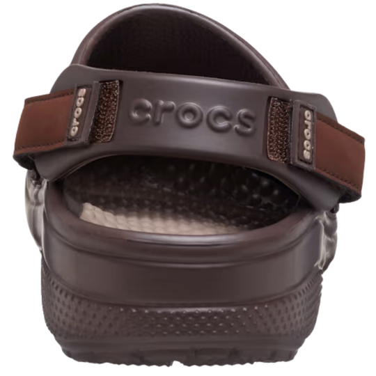 Brown Crocs sandal on a white background